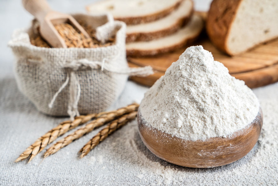 Wheat and flour on the table Whole Wheat Flour and Bread